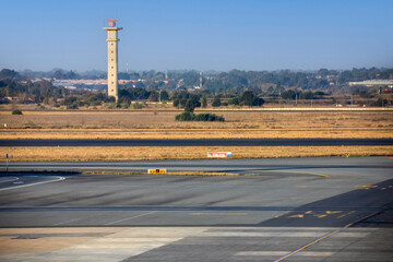 Runways with control tower at Johannesburg International Airport in South Africa, the busiest and...