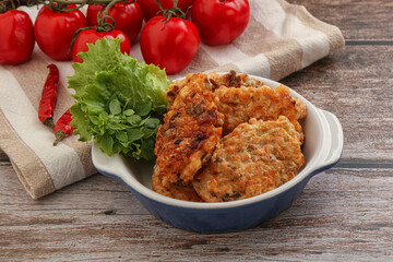 Fried salmonn cutlet in the bowl