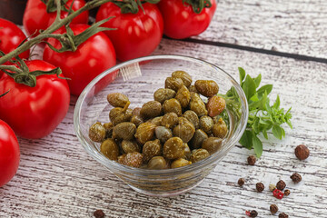 Marinated green capers in the bowl