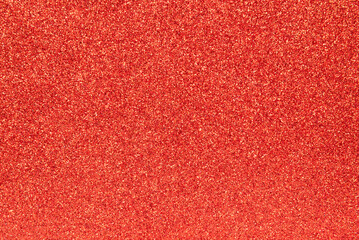 Fototapeta premium Red glitter background. Sparkling shiny wrapping paper texture wallpaper decoration.