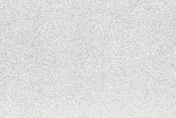 Silver glitter background. Sparkling shiny wrapping paper texture wallpaper decoration.