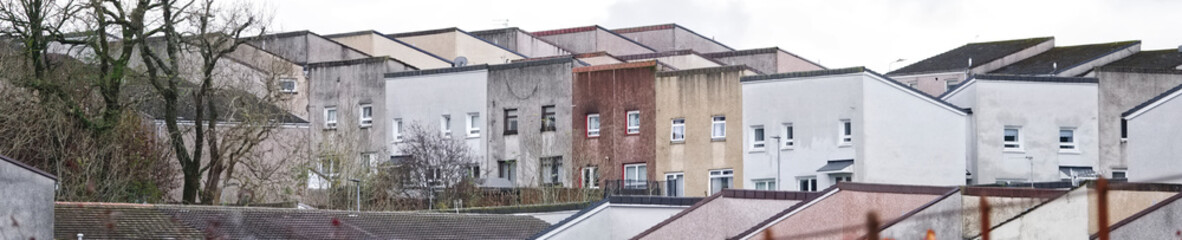 Fototapeta na wymiar Derelict council house in poor housing estate slum with many social welfare issues in Port Glasgow
