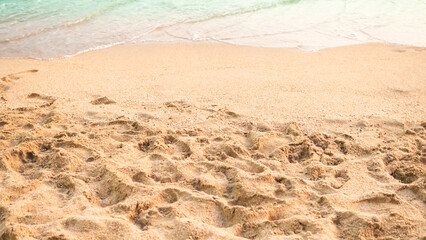 Wave on sand background at coast. beautiful texture wavy white foam blue ocean on beach coastline. sandy with sea nature. transparent water seascape island photography. vacation tropical summer.