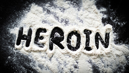 Heroin drug. powder heroin on dark black table background. for abuse, narcotic,cocaine crime addict concept.