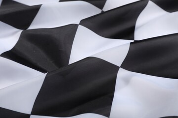 Checkered finish flag as background, closeup view