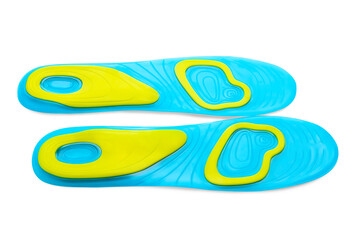 Light blue orthopedic insoles isolated on white