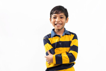 Smiling Indian boy standing in front of camera