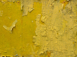 Rusted yellow painted metal wall .close up