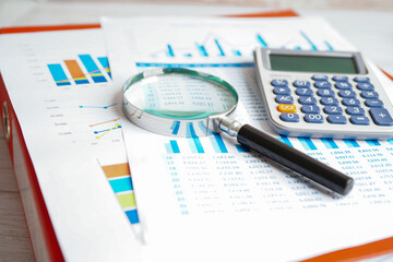 Calculator on chart and graph spreadsheet paper. Finance development, Banking Account, Statistics,...