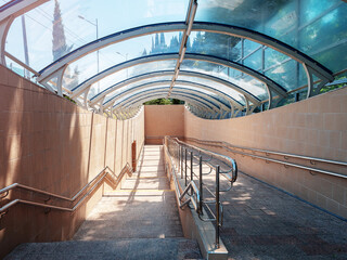 Descent to the underground passage. Glass dome canopy. Modern urban architecture