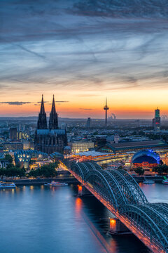 Cologne skyline at sunset with view of Cologne Cathedral and Hohenzollern Bridge, North Rhine-Westphalia, Germany