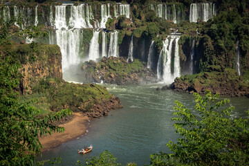 Tourist boat exploring Iguazu Falls on the border of Brazil and Argentina.