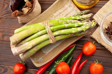 asparagus bunch on wood background