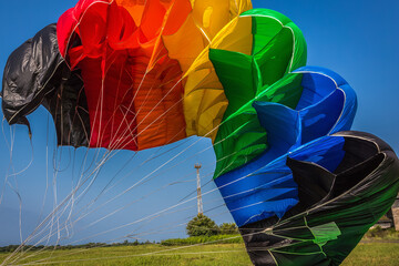 Abлhazia Sukhum Babushara 09.14.2017  Canopy of colorful parachute in blue sky. A background with an abstract view of a colorful parachute. Parachute jumps. Active life style.