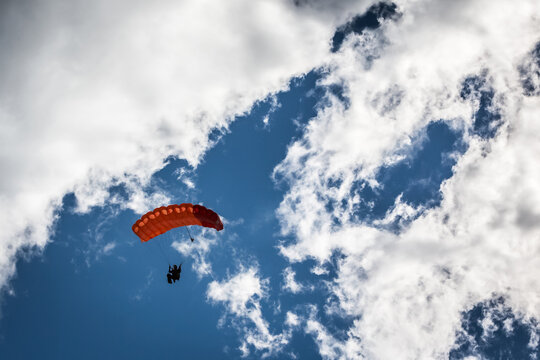 Russia Moscow region Vatulino. 08.08.2018 Colorful parachut on the dramatic sky with stormy clouds. Parachute jumps. Active life style.
