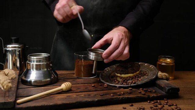 Chef prepares black coffee with chocolate donuts. Close-up 4k video shooting