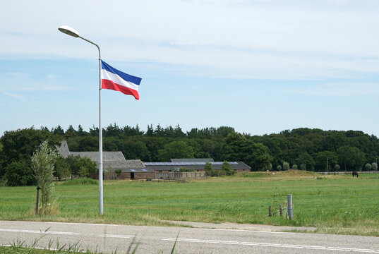 Dutch National Flag Hanging Upside Down Near A Farm As A Sign Of Protest Against The Nitrogen Policy And Plans Of The Government