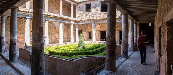 POMPEII, ITALY - MAY 04, 2022 - Yard in a typical Roman villa of the ancient Pompeii, Italy
