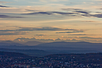 Obraz premium beautiful landscape view from a height to the village, mountains and picturesque cloudy sky