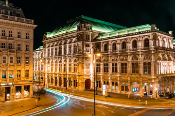 Fototapeta na wymiar Light trails in front of the Opera House at night in Vienna, Austria