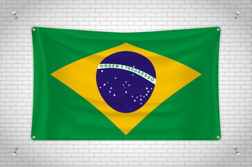 Obraz premium Brazil flag hanging on brick wall. 3D drawing. Flag attached to the wall. Neatly drawing in groups on separate layers for easy editing.