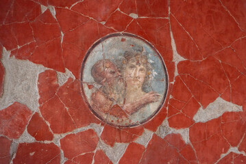 HERCULANEUM, ITALY - MAY 05, 2022 - Ornate wall painting in the house of the Tuscan Colonnade