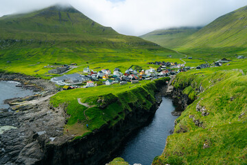 Gjógv gorge harbour, Faroe islands, Denmark, Europe : One of the most iconic place in the Faroe...