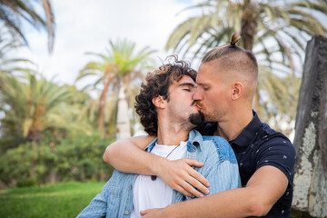 Two boys in love kiss, same sex couple during a passionate moment