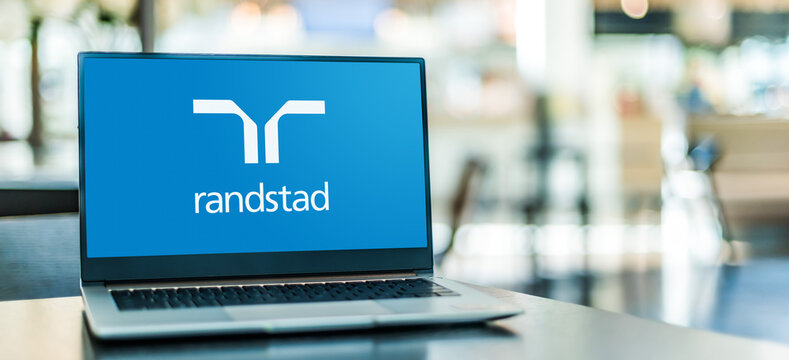 Laptop computer displaying logo of Randstad