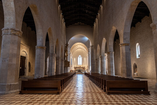 L'AQUILA, ITALY - MAY 06, 2022 - Empty main aisle of the after earthquake rebuilt Romanesque Basilica Santa Maria di Collemaggio in L'Aquila, Italy