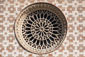 Typical Romanesque rose window of the portal of Basilica Santa Maria di Collemaggio in L'Aquila,...