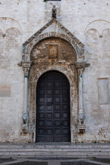 Fototapeta na wymiar Facade of iconic basilica San Nicola in downtown Bari, Southern Italy