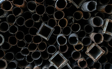 Pile of rusty metal pipes as industrial background. backdrop of downpipe. - obrazy, fototapety, plakaty