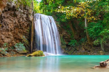 Fototapeta na wymiar Erawan Waterfall with blue water beautiful nature in Thailand
