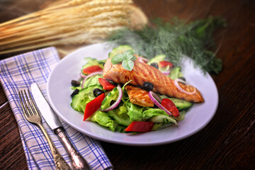 Delicious grilled salmon served with salad