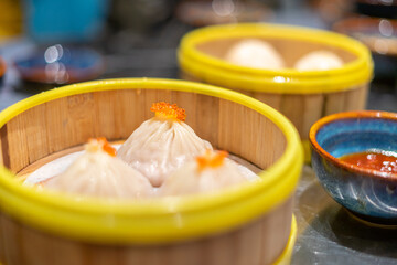 Dim Sum in bamboo steamer, Chinese cuisine. Closeup rustic style. horizontal. Selective focus
