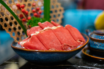 Raw beef slice for hot pot, fresh snowflake beef slices, chinese food. Selective focus.