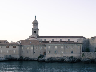 Coastal town Krk on island Krk, Croatia, bayside Frankopan fortress and bell tower