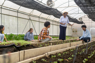 Group of mixed race students and teacher learning agriculture  technology in smart farming , education ecology agricultural concepts .