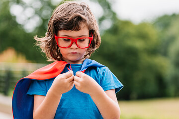 Little superhero with on cape