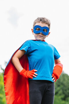 Little superhero with flying cape