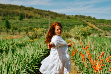 Fototapeta na wymiar woman in a field of flowers
