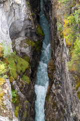 Teal water flowing through Marble Canyon in Kootenay National Park Canada