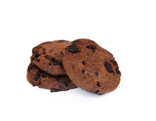 Dark cookies with chocolate chips on a white background. Shallow depth of field