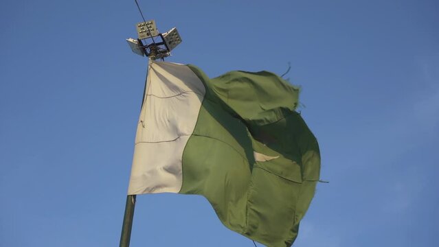 Old Pakistan flag waving. recorded in slow motion.