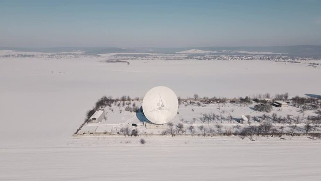 Aerial View of the Space Communication Station in Snow Covered Field at Sunny Winter Day, Drone Flight Over Strategic Object