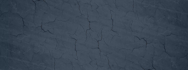 Abstract dark blue surface or painted wall texture, old and decorative blue grunge texture with cracks, blue background for wallpaper, cover, design and decoration.