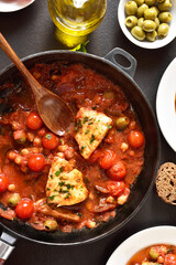 Cod stew with chickpeas, cherry tomatoes and olives