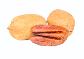Two shelled nuts with half a pecan isolated on white background