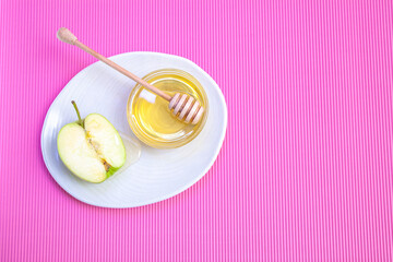 Fresh green apple and a half of an apple in a cut on a white background 